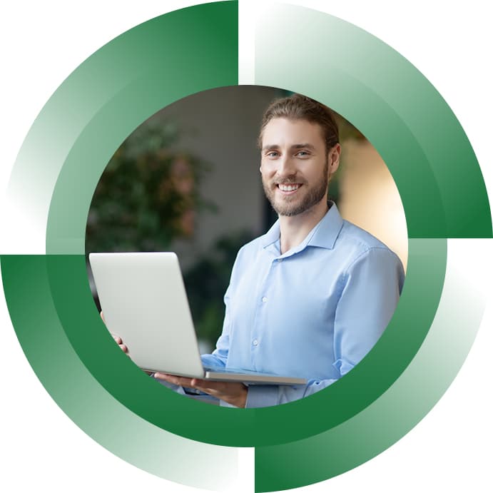 man holding laptop and smiling
