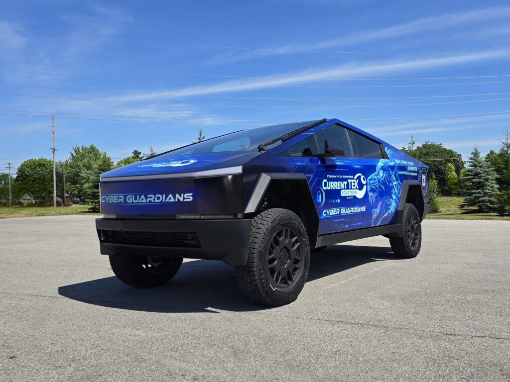 Cybertruck wrapped in Current TEK Solutions branded messaging